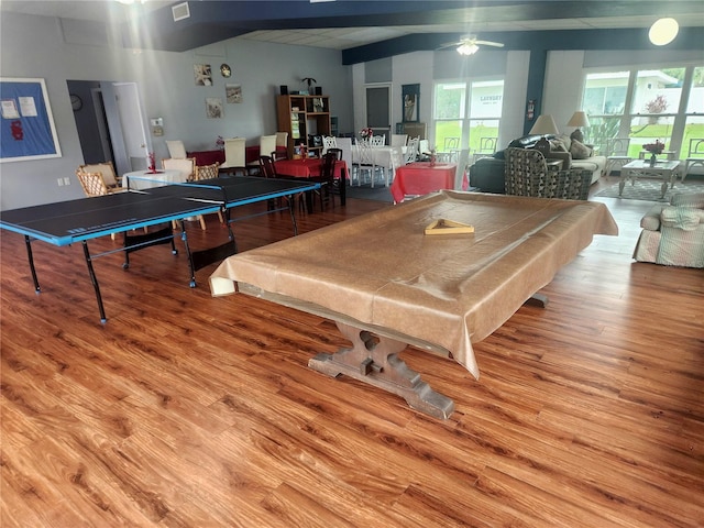 game room with hardwood / wood-style floors, ceiling fan, beam ceiling, and billiards