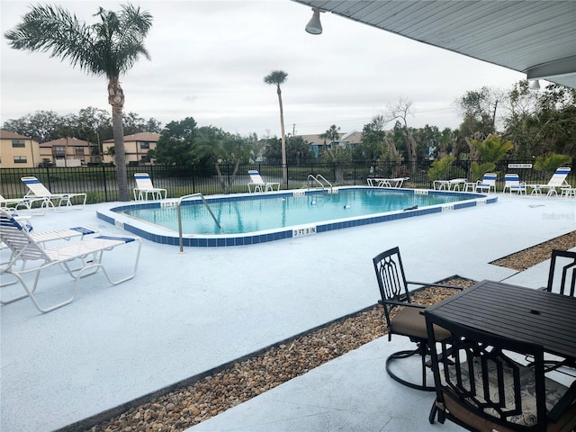 view of swimming pool with a patio area