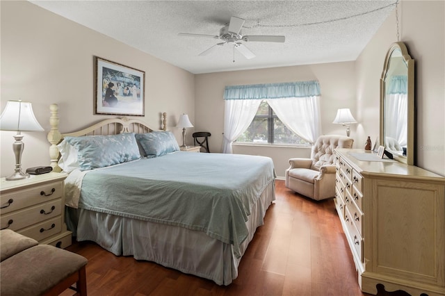 bedroom featuring a textured ceiling, ceiling fan, and hardwood / wood-style floors