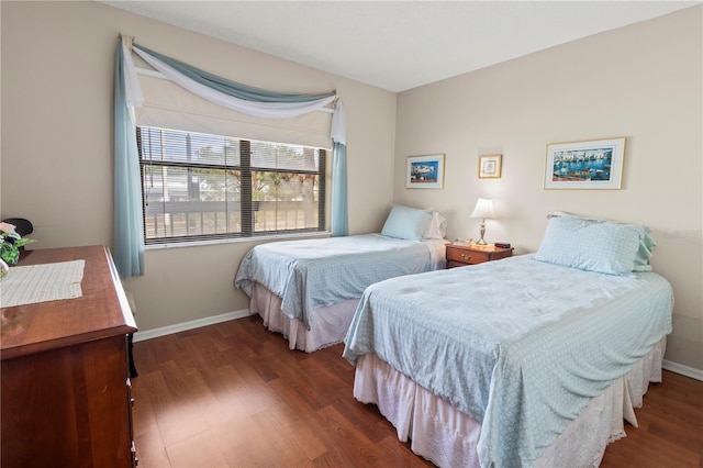 bedroom featuring dark wood-type flooring