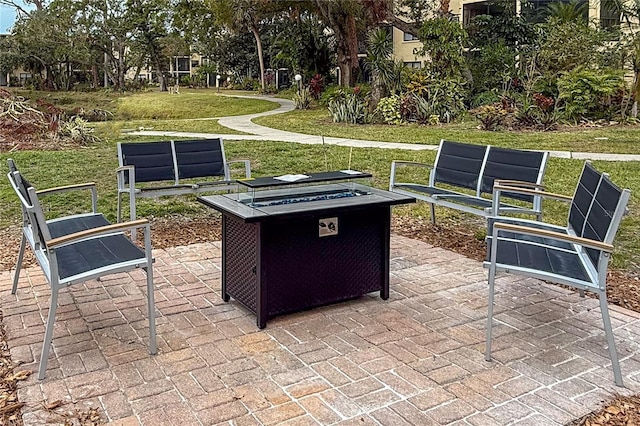 view of patio / terrace featuring an outdoor fire pit