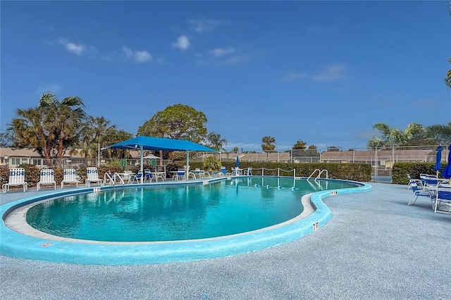 view of pool featuring a patio area