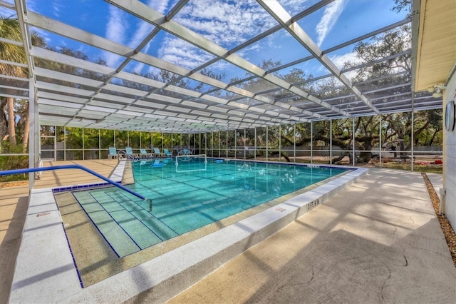 view of pool featuring a lanai and a patio