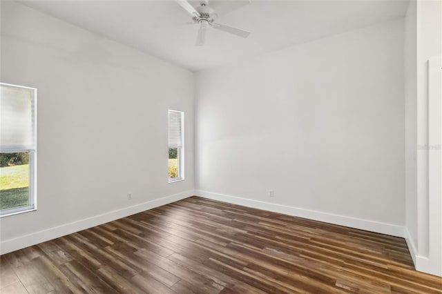 empty room featuring dark hardwood / wood-style floors and ceiling fan