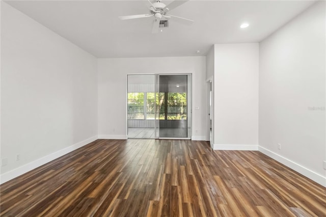 spare room featuring ceiling fan and dark hardwood / wood-style flooring