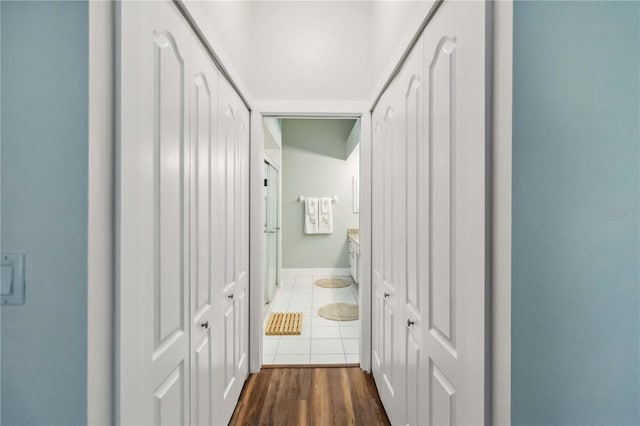 corridor featuring dark tile patterned floors