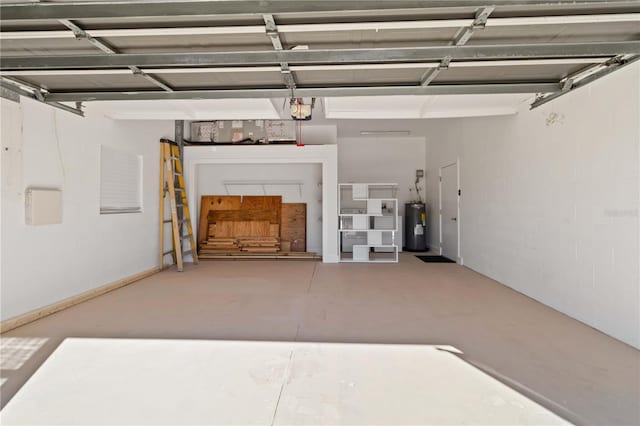 garage featuring electric water heater and a garage door opener