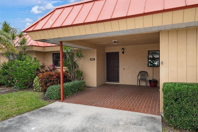 entrance to property with a carport