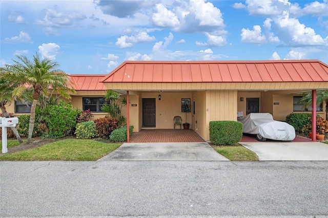 view of front of property with a carport