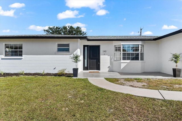 ranch-style house with a front yard