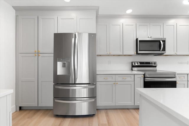 kitchen featuring light hardwood / wood-style flooring and appliances with stainless steel finishes