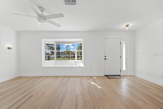 entryway with ceiling fan and light hardwood / wood-style flooring