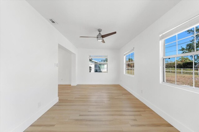 spare room featuring ceiling fan and light hardwood / wood-style floors