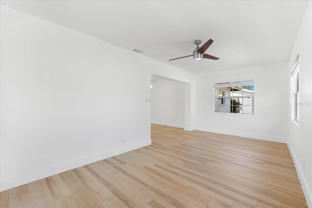 spare room featuring ceiling fan and light hardwood / wood-style floors