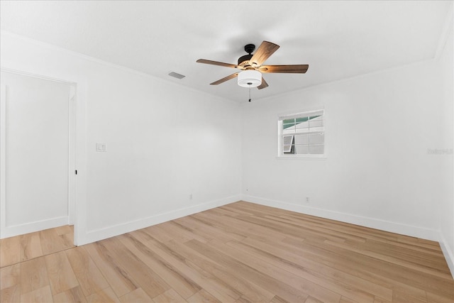 unfurnished room featuring light wood-type flooring and ceiling fan