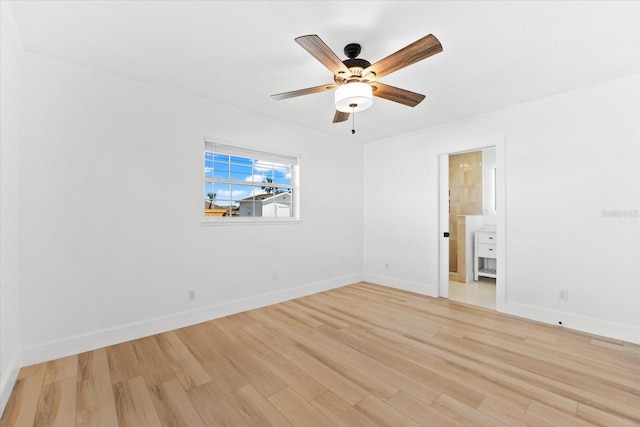 spare room with light hardwood / wood-style flooring and ceiling fan