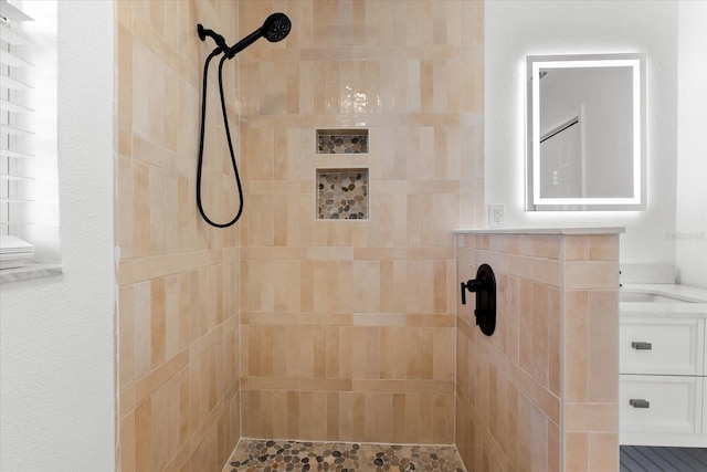 bathroom with a tile shower