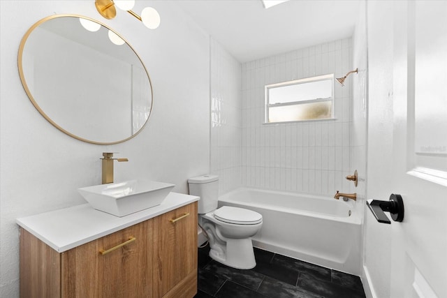 full bathroom with tile patterned floors, tiled shower / bath combo, toilet, and vanity