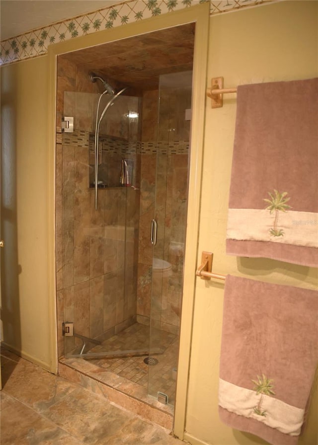 bathroom with a shower with shower door