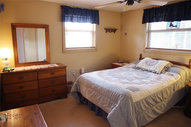 carpeted bedroom with ceiling fan