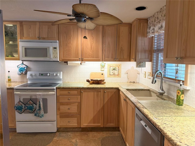 kitchen with range with electric stovetop, decorative backsplash, sink, and stainless steel dishwasher