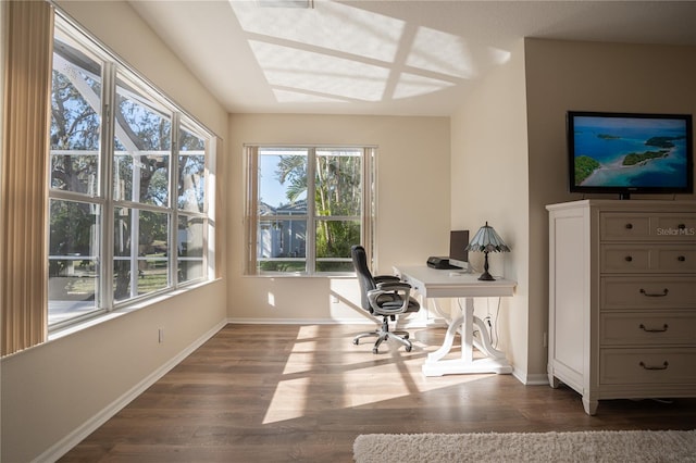 unfurnished office with dark hardwood / wood-style flooring