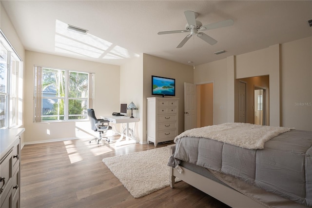 bedroom with hardwood / wood-style floors and ceiling fan