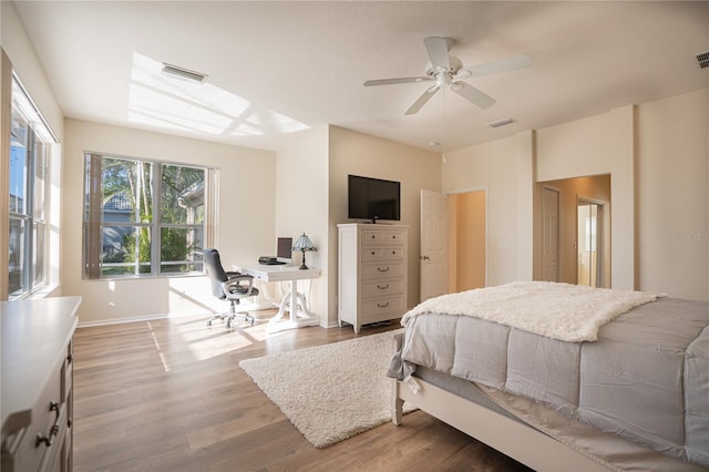 bedroom with hardwood / wood-style floors and ceiling fan