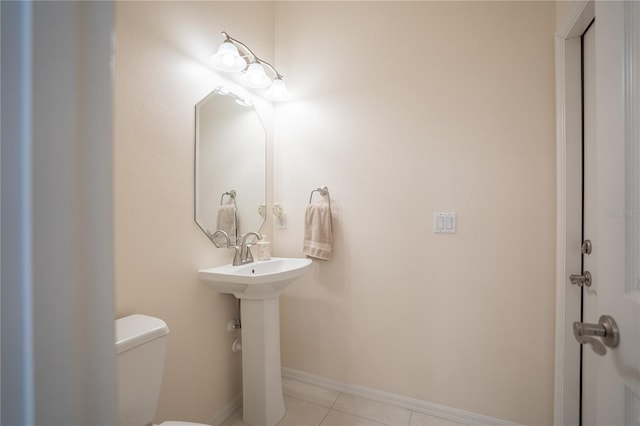 bathroom featuring tile patterned floors and toilet