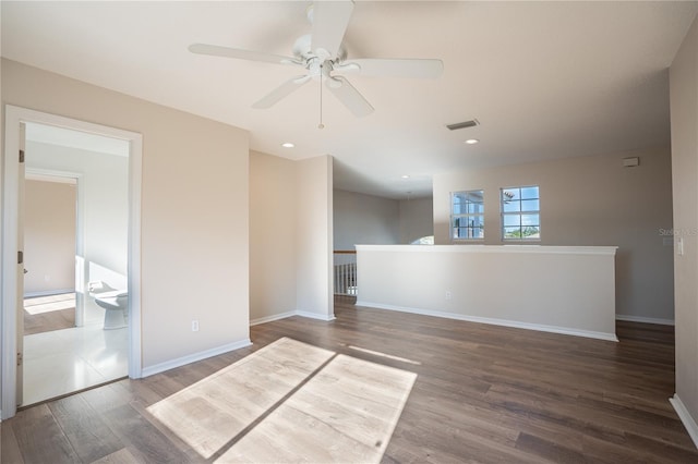 empty room featuring ceiling fan and wood-type flooring