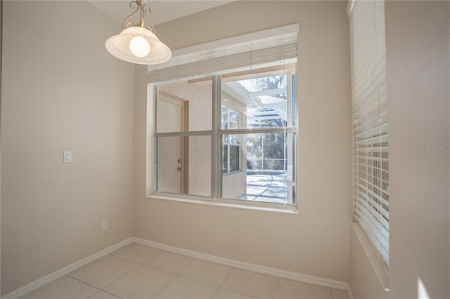 empty room with light tile patterned floors