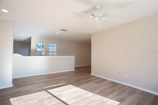 spare room featuring hardwood / wood-style floors and ceiling fan