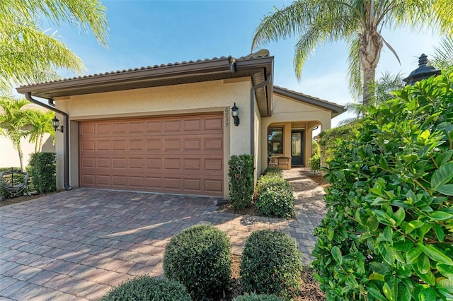 mediterranean / spanish home with a garage