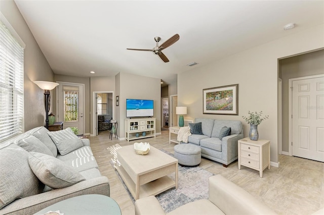 living room with ceiling fan