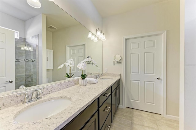 bathroom with toilet, tile patterned floors, a shower with shower door, and vanity