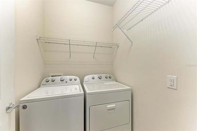 washroom with washer and dryer