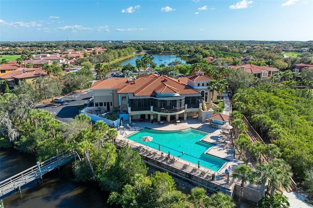 birds eye view of property with a water view