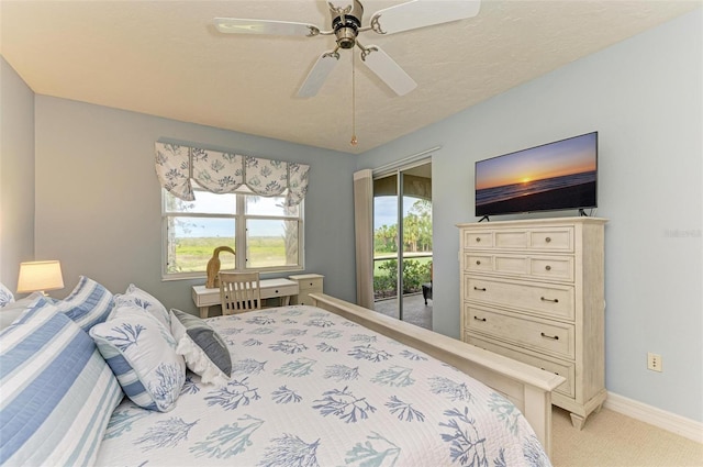 bedroom with ceiling fan, light colored carpet, access to outside, and multiple windows