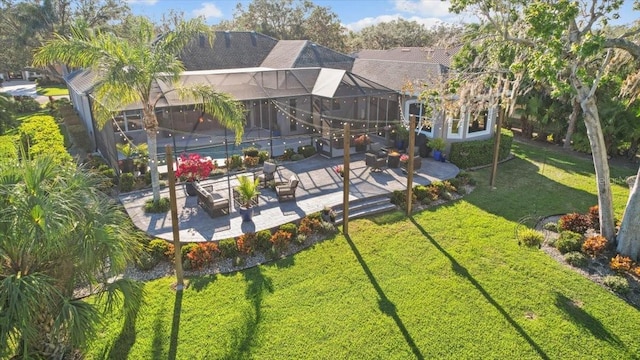 view of yard featuring an outdoor living space, a patio, and a lanai