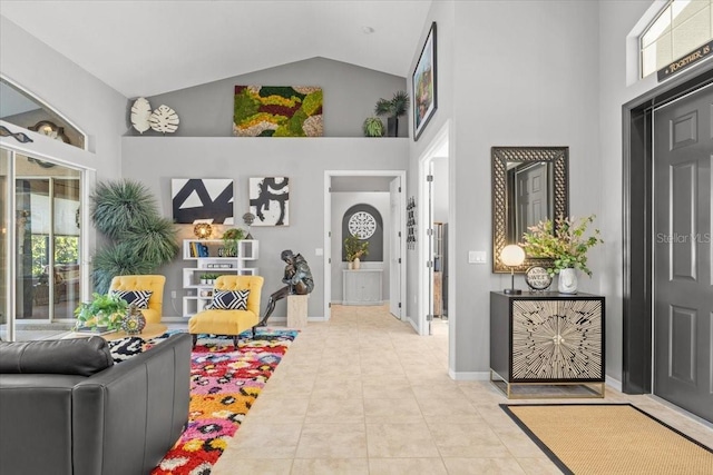 tiled foyer with high vaulted ceiling