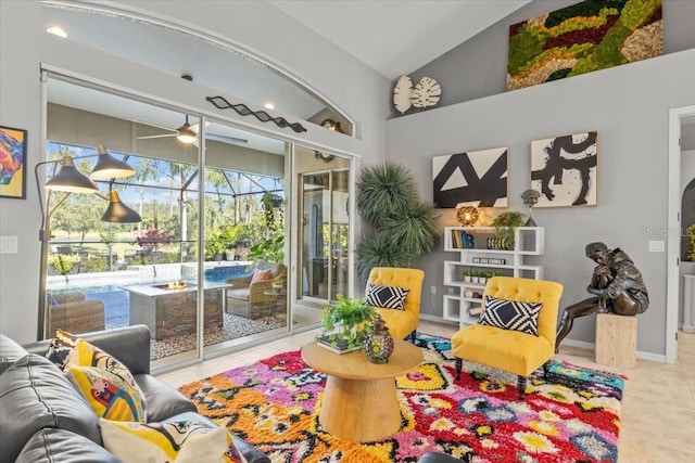 playroom featuring ceiling fan, lofted ceiling, and light tile patterned floors