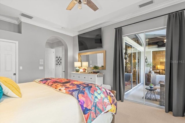 carpeted bedroom featuring ceiling fan, access to exterior, crown molding, and multiple windows