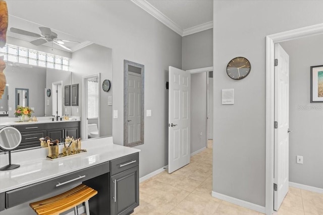 bathroom featuring vanity, ceiling fan, crown molding, tile patterned flooring, and toilet