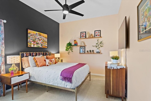 bedroom featuring ceiling fan and light carpet