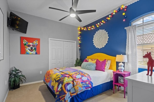 bedroom with light carpet, a closet, and ceiling fan