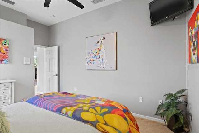 bedroom with light colored carpet and ceiling fan