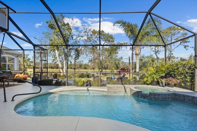 view of swimming pool featuring a patio area, a lanai, and an in ground hot tub