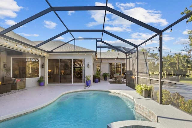 view of pool featuring a lanai and a patio area