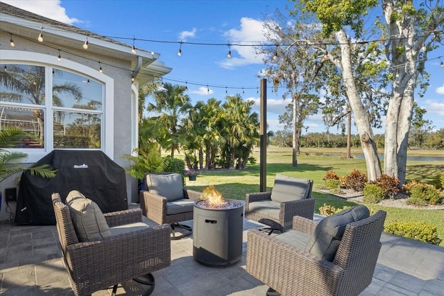 view of patio / terrace featuring area for grilling and a fire pit