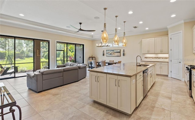 kitchen featuring sink, dishwasher, ceiling fan, light stone countertops, and a center island with sink